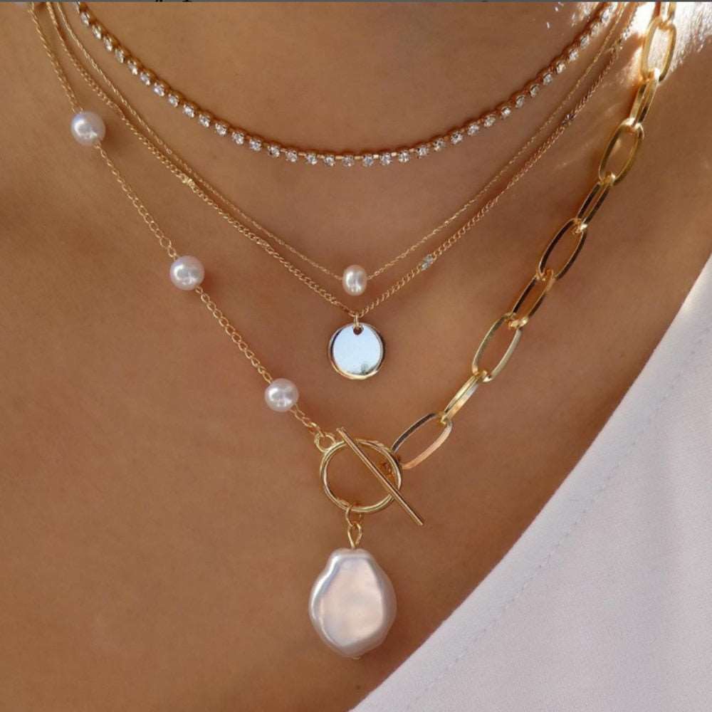 Statement-making gold necklace featuring an array of captivating styles
