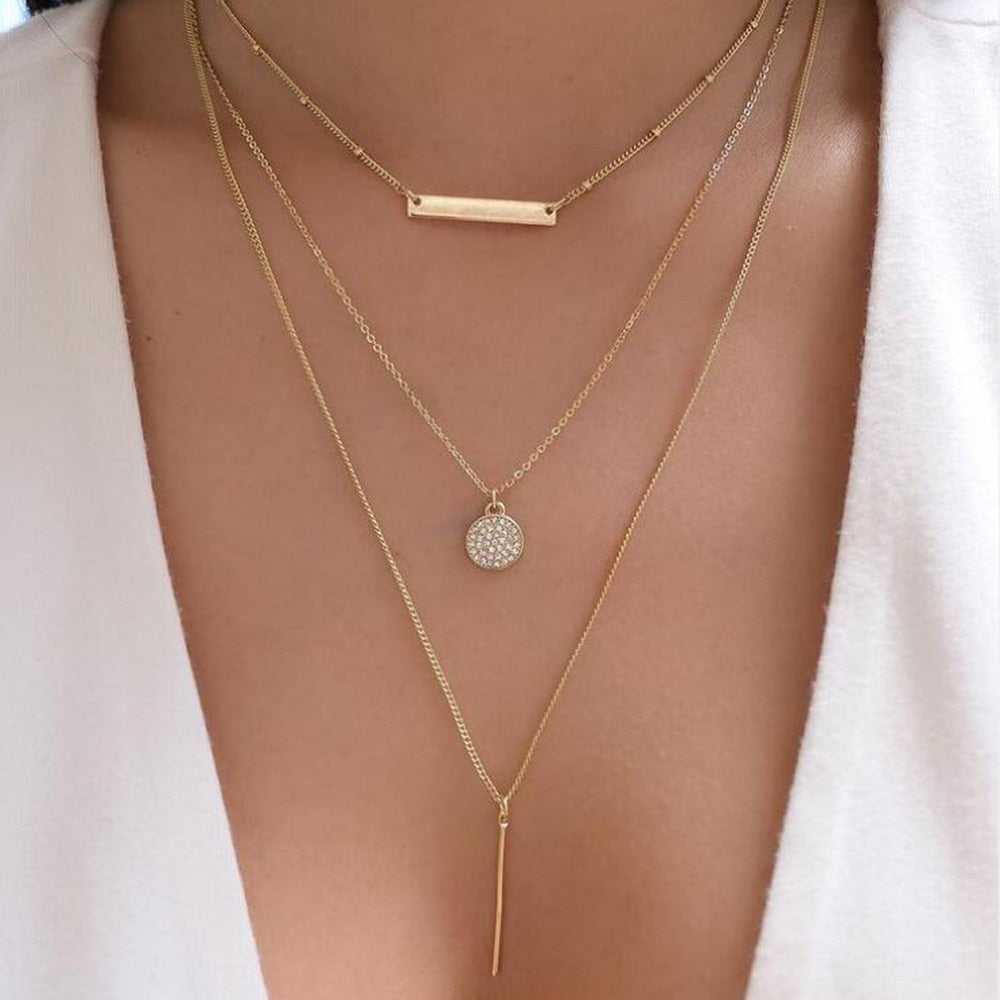 Elegant gold necklace with a collection of eye-catching designs