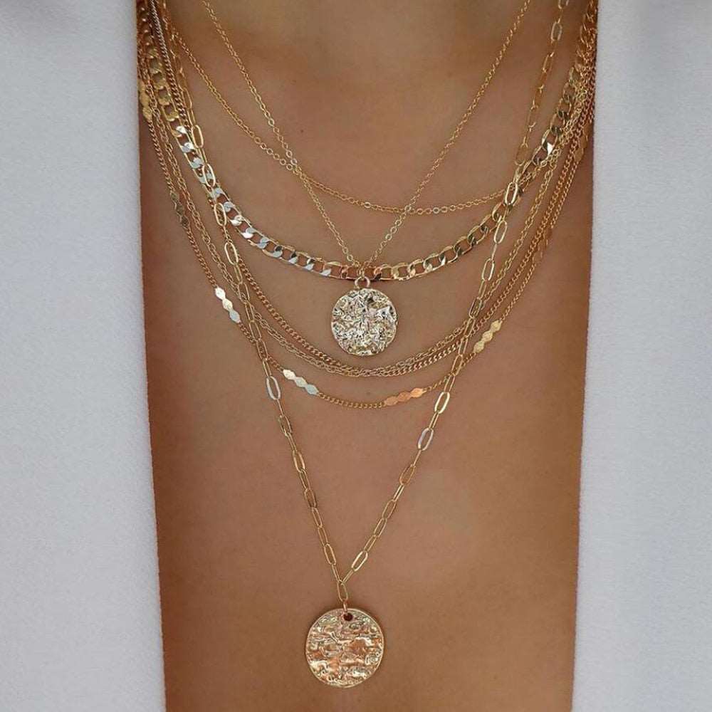 Luxurious gold necklace presenting a variety of elegant designs