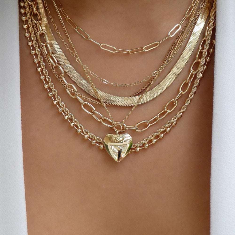 Versatile gold necklace with an eclectic mix of trendy styles