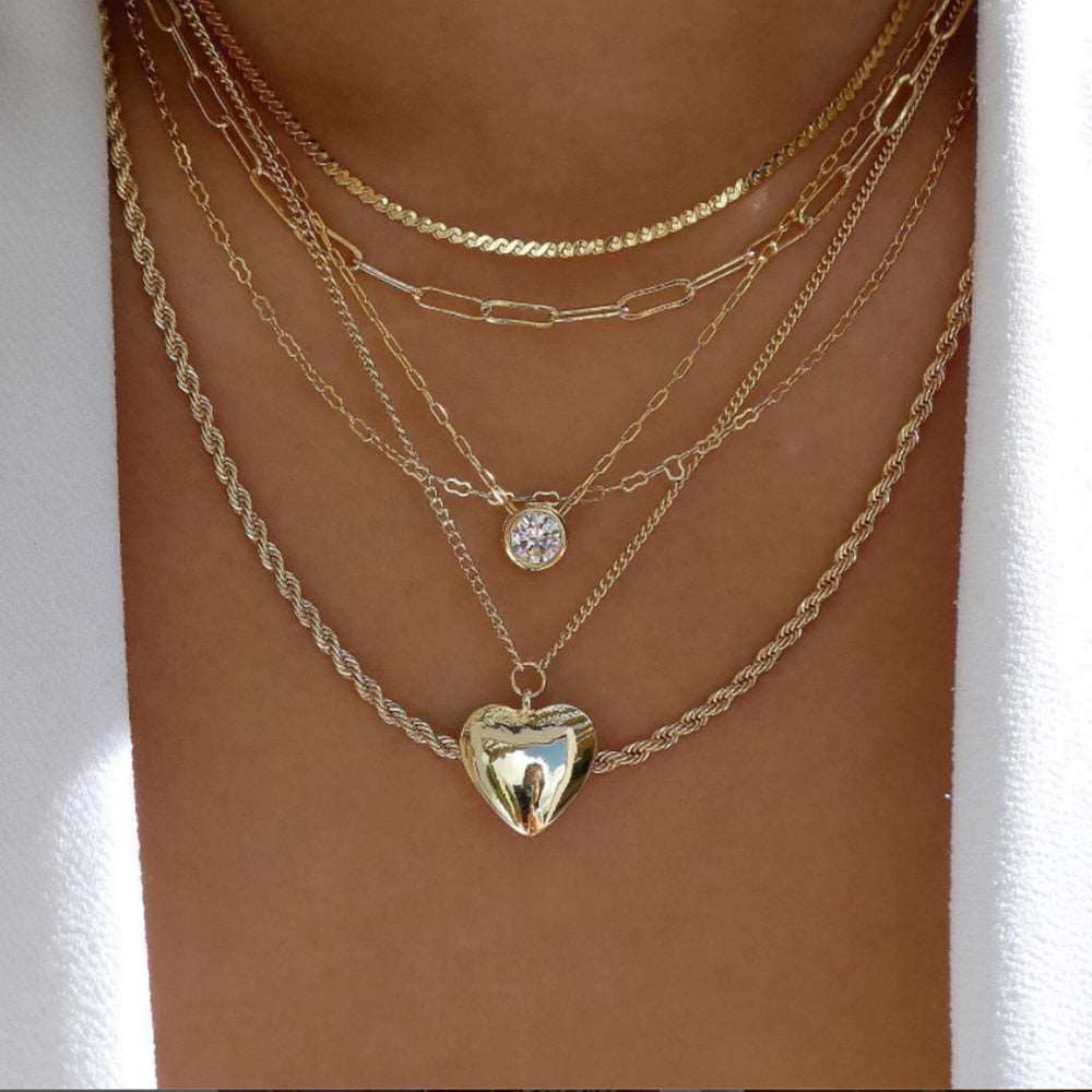 Statement-making gold necklace with diverse and unique styles